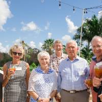 Group of seven guests standing outside in the sun at Naples 2019